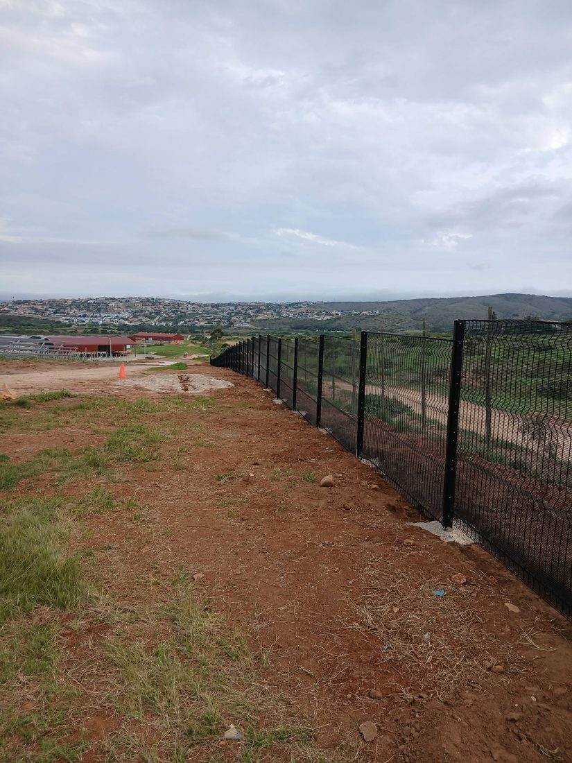 Black Clearview security fence along the boundary of the Hartenbos wastewater works