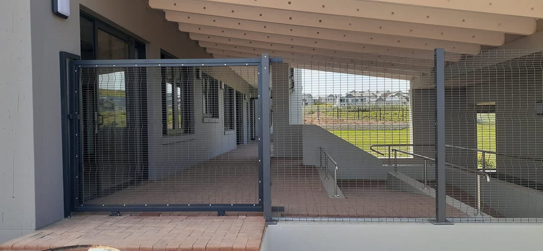 Clearview-clad pedestrian gate on the covered walkway at King's College