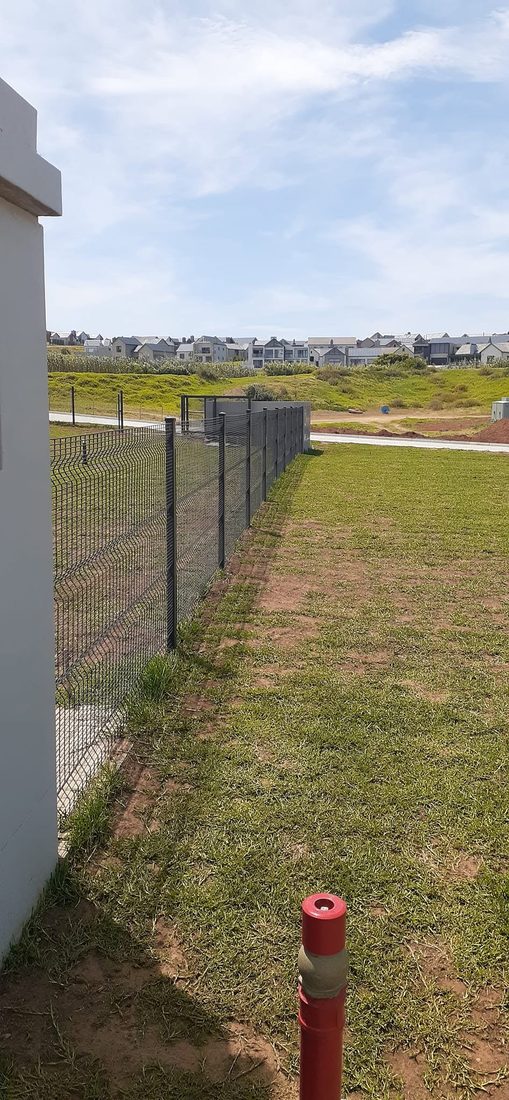 Clearview boundary fencing beside a classroom block at King's College, Hartenbos