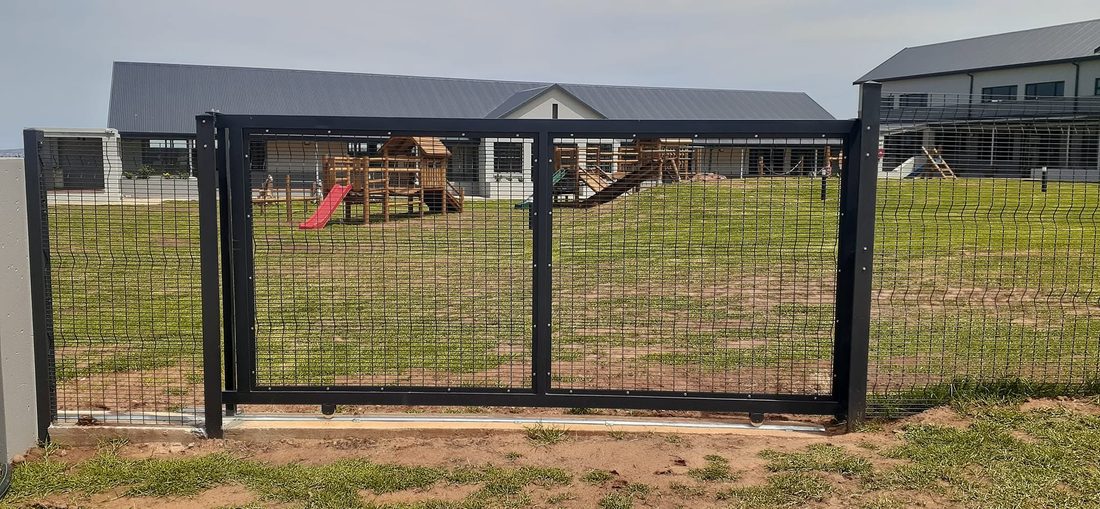 Black Clearview sliding gate onto the playground at King's College, Hartenbos