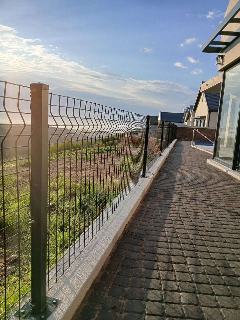 Clearview security mesh fence on a retaining wall at Renosterbos Estate